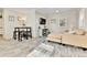 Cozy living room featuring modern wood-look flooring, neutral tones, and recessed lighting at 2171 S Cherokee St, Denver, CO 80223