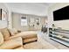 Bright living room with a comfortable chaise lounge and an entertainment area at 2171 S Cherokee St, Denver, CO 80223