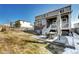 A well-maintained backyard features a patio with table and seating, perfect for outdoor entertaining at 13437 Starhawk Ln, Parker, CO 80134