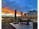 Enjoy outdoor living on this patio as you gaze at the mountain views and picturesque sunset at 13437 Starhawk Ln, Parker, CO 80134
