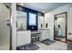 Bathroom featuring a dual vanity, large mirrors, tile floors, and a glass shower at 13437 Starhawk Ln, Parker, CO 80134