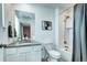 Bright bathroom featuring white subway tile shower over tub, a mirror, and a convenient sink at 13437 Starhawk Ln, Parker, CO 80134