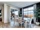 Cozy dining area with a wooden table, four chairs, and a view of the outdoor space at 13437 Starhawk Ln, Parker, CO 80134