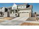 Charming two-story home features a covered front porch and attached two-car garage at 13437 Starhawk Ln, Parker, CO 80134