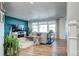 Spacious living room with a large window, hardwood floors, and a modern design at 13437 Starhawk Ln, Parker, CO 80134