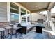 Covered patio with comfortable seating and a barbecue grill, perfect for outdoor entertaining at 13437 Starhawk Ln, Parker, CO 80134