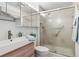 Updated bathroom featuring modern vanity, stylish fixtures, and glass shower at 7877 E Mississippi Ave # 208, Denver, CO 80247