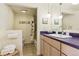Updated bathroom features modern vanity, updated fixtures, and shower-tub combo at 7877 E Mississippi Ave # 208, Denver, CO 80247
