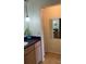 Bathroom featuring modern vanity, updated fixtures, and tiled floors at 7877 E Mississippi Ave # 208, Denver, CO 80247