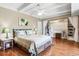 Bedroom featuring hardwood floors, ceiling fan, and walk-in closet with custom shelving at 7877 E Mississippi Ave # 208, Denver, CO 80247