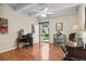 Bedroom showcasing hardwood floors, ceiling fan, and natural light from the exterior at 7877 E Mississippi Ave # 208, Denver, CO 80247