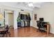 Spacious bedroom including hardwood floors, closet with custom shelving, and natural light at 7877 E Mississippi Ave # 208, Denver, CO 80247
