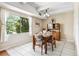 Charming dining room featuring tile floors, a vintage hutch, and a bright window with natural light at 7877 E Mississippi Ave # 208, Denver, CO 80247