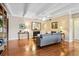 Cozy living space with hardwood floors, fireplace, and custom built-in shelving at 7877 E Mississippi Ave # 208, Denver, CO 80247