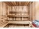 Beautiful sauna with wooden benches, paneling, and heater, offering a relaxing experience at 7877 E Mississippi Ave # 208, Denver, CO 80247