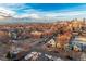 A captivating aerial view of a neighborhood with Denver skyline in the distance at 115 W 2Nd Ave # 101, Denver, CO 80223