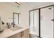 Modern bathroom with sleek vanity, stylish mirror, and glass-enclosed shower at 115 W 2Nd Ave # 101, Denver, CO 80223