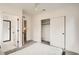 Well-lit bedroom with modern closet and en suite bathroom featuring a glass shower at 115 W 2Nd Ave # 101, Denver, CO 80223