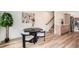 Bright dining area with hardwood floors, modern table set, and tasteful decor at 115 W 2Nd Ave # 101, Denver, CO 80223