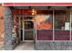 Charming storefront with 'Pie Hole' neon sign, creating a fun and inviting atmosphere at 115 W 2Nd Ave # 101, Denver, CO 80223