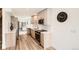 Stylish kitchen with stainless steel appliances, sleek cabinetry, and an open layout connecting to the living room at 115 W 2Nd Ave # 101, Denver, CO 80223
