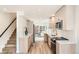 Well-lit kitchen with stainless steel appliances, sleek cabinetry, and an open layout perfect for entertaining at 115 W 2Nd Ave # 101, Denver, CO 80223