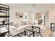 Bright living room featuring a comfortable sofa, modern decor, and an open layout leading to the kitchen at 115 W 2Nd Ave # 101, Denver, CO 80223