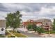 Charming neighborhood street view featuring mature trees and diverse architectural styles at 115 W 2Nd Ave # 101, Denver, CO 80223