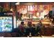 Diners at a Japanese restaurant, sitting at the counter where the chef prepares the dishes at 115 W 2Nd Ave # 101, Denver, CO 80223