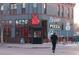 Exterior view of a restaurant with large windows and signage for pizza and beer at 115 W 2Nd Ave # 101, Denver, CO 80223