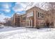 Classic brick school building with architectural details surrounded by a snow-covered landscape at 115 W 2Nd Ave # 101, Denver, CO 80223