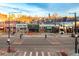 A wide crosswalk with a view of local businesses and city skyline at 115 W 2Nd Ave # 101, Denver, CO 80223