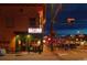 Night shot of a lively street with restaurants, retail, and pedestrian traffic at 115 W 2Nd Ave # 101, Denver, CO 80223