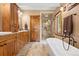 Elegant bathroom showcasing a double vanity, walk-in shower, and a freestanding soaking tub at 187 Marion Dr, Evergreen, CO 80439