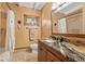 A bathroom with custom granite counters, decorative wood accents, and a neutral color palette at 187 Marion Dr, Evergreen, CO 80439