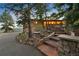 Exterior nighttime view of a mountain home featuring stone steps and landscape lighting at 187 Marion Dr, Evergreen, CO 80439