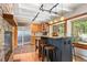 Spacious kitchen with stone countertops, an island with seating, and stainless steel refrigerator at 187 Marion Dr, Evergreen, CO 80439