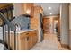 Mudroom features a laundry setup, a utility sink, and cabinetry, offering practical storage and convenience at 187 Marion Dr, Evergreen, CO 80439