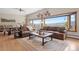 Inviting living area with beamed ceilings, mountain views, and a cozy seating arrangement at 187 Marion Dr, Evergreen, CO 80439