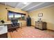 An office space with natural light features a large window with mountain views, providing a bright workspace at 187 Marion Dr, Evergreen, CO 80439