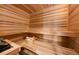 Relaxing sauna features wood paneled walls, seating, and traditional sauna accessories at 187 Marion Dr, Evergreen, CO 80439