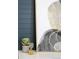 Close up of modern artwork with gold accents and a decorative hourglass on a side table at 1117 S Madison St, Denver, CO 80210