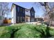 Lovely two-story home with a modern black and white exterior and spacious backyard, perfect for outdoor living at 1117 S Madison St, Denver, CO 80210