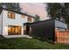 Backyard view showcases manicured lawn, modern exterior, and seamless indoor-outdoor flow at 1117 S Madison St, Denver, CO 80210
