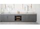 Modern bathroom featuring a double vanity with round mirrors and sleek gray cabinetry at 1117 S Madison St, Denver, CO 80210