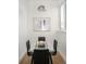 Elegant dining room with a glass-top table and modern lighting at 1117 S Madison St, Denver, CO 80210