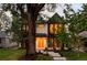 Charming two-story home with black and white exterior, large windows, and landscaped front yard at 1117 S Madison St, Denver, CO 80210