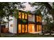 Striking two-story home showcasing a modern design with large windows offering ample natural light at 1117 S Madison St, Denver, CO 80210