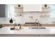 Well-equipped kitchen features stainless steel appliances, sleek cabinetry, and designer backsplash at 1117 S Madison St, Denver, CO 80210