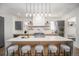 Modern kitchen with a large center island, stylish pendant lighting, and sleek stainless-steel appliances at 1117 S Madison St, Denver, CO 80210